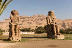 Stand next to the great Colossi of Memnon, Luxor