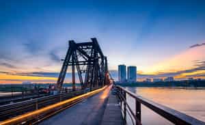 Walk across the Long Bien Bridge in Hanoi