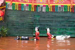 Watch a traditional water puppet show in Hanoi