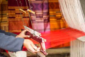 Watch Lao silk weavers in Luang Prabang