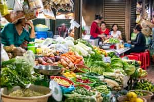 Taste local flavours at a Cambodian market 