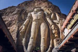 See the towering statue at the Mulbekh Monastery
