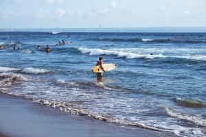 Take on the waves on a surfing lesson in Canggu