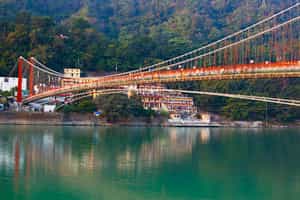 Visit the Ram Jhula bridge in Rishikesh