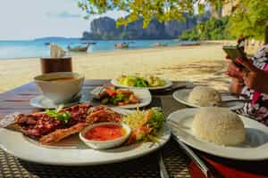 Enjoy a delicious Thai lunch on the beach