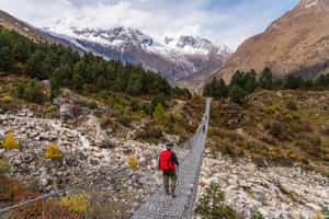 Walk across the suspension bridges in Manaslu