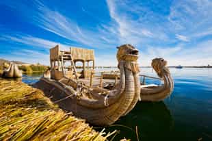 Float across Lake Titicaca in a traditional boat