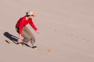 Sandboard down the dunes of the Atacama Desert