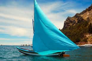 Take in the sunset on a sailboat on Lake Titicaca