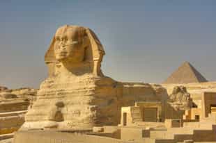 See the Great Sphinx and pyramids of Giza