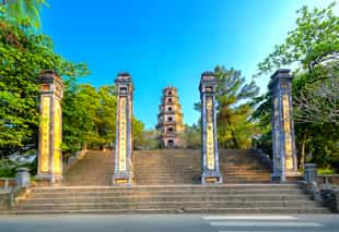 Stand at the foot of the Thien Mu Pagoda in Hue