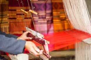 Watch Lao silk weavers in Luang Prabang