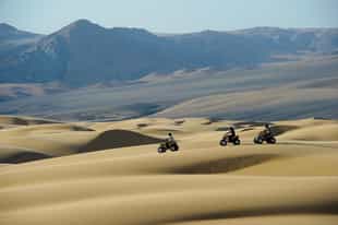Ride a quad bike across the dunes of Kaokaland 