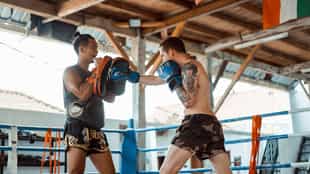 Attend a Thai kickboxing match in Bangkok