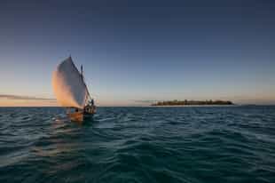 Take a traditional dhow sunset cruise in Mafia