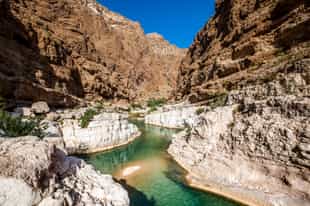 Go canyoning at Hawer Falls in Wadi Hawir