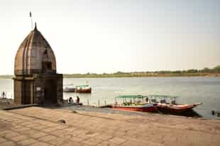 Take a boat ride on the Narmada River, Maheshwar