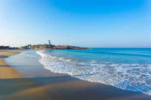 Relax on the soft sandy beaches of Kovalam