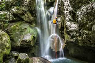 Go rappelling down a waterfall in Kerenkali
