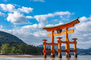 See the grand Itsukushima shrine, Miyajima Island