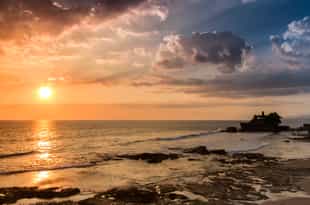 Take a scenic cycle to Tanah Lot temple for sunset