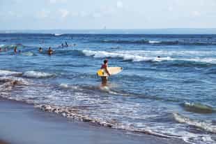 Take on the waves on a surfing lesson in Canggu