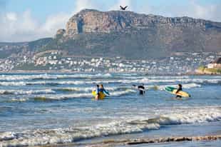 Take a surfing lesson in Muizenberg