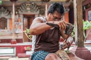 Visit local wood carvers and artisans in Ubud