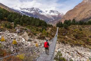 Walk across the suspension bridges in Manaslu
