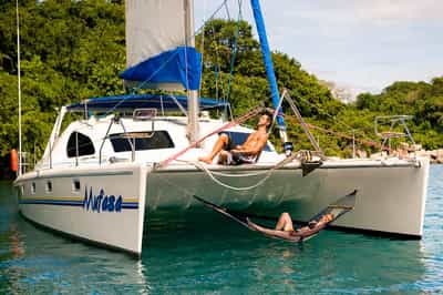 Kick your feet up on a catamaran on Lake Malawi