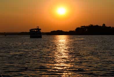 Float down the Zambezi on a sundowner cruise