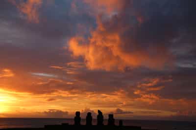 Watch the sunset on the moai of Ahu Tahai