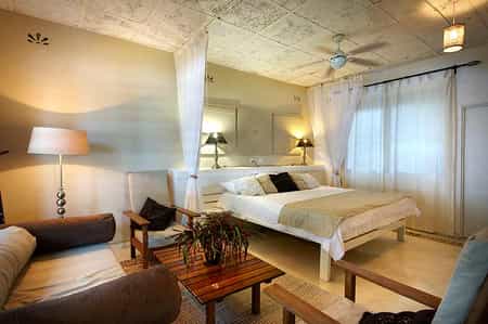 Spacious Main Bedroom with En Suite Bathroom and Mosquito Nets