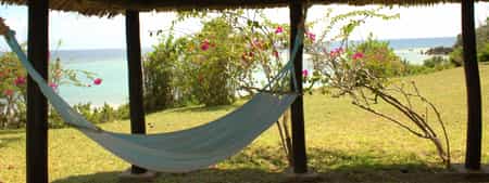 Located just 33 km South from the bustling city of Dar es Salaam and set among 80 acres of beautiful tropical gardens, Protea Hotel Amani Beach has ten luxury beach bungalows that overlook the turquoise waters of the Indian Ocean.