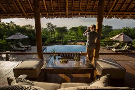 Lounge room overlooking the pool and waterhole