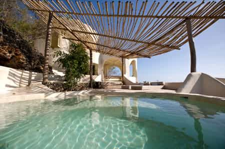 A day pavilion with plunge pool and sun lounger for relaxing 