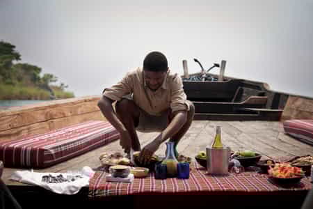 The journey is always part of the destination. After landing at the Mahale airstrip, you board the dhow for a gentle 90min cruise down the lakeshore, with a picnic spread and a glass of chilled wine in hand.