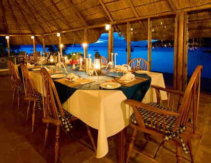 Dining on the thatched gazebo overlooking the sparkling Lake Malawi