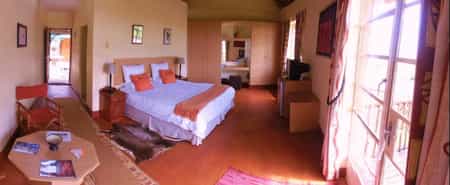 Entry from the central courtyard and access to private deck through french doors