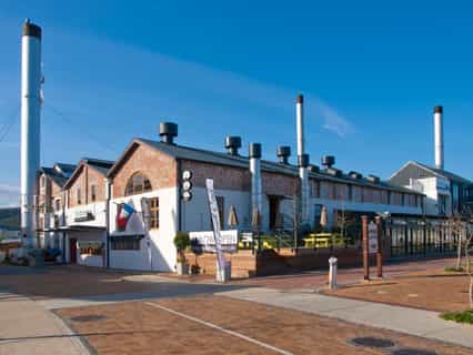 A historical building retains the exterior reflecting life as a power station.