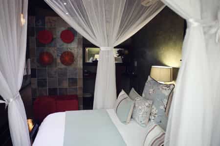 The Suite, Windfall Cottage, is privately situated under Marula trees and consists of a lounge with DSTV, romantic bedroom, en-suite bathroom and an outside shower in a privately fenced Boma area.