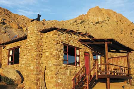 Each of the natural rock chalets sits between massive granite boulders and contains a bathroom, kitchenette, fireplace and private veranda.