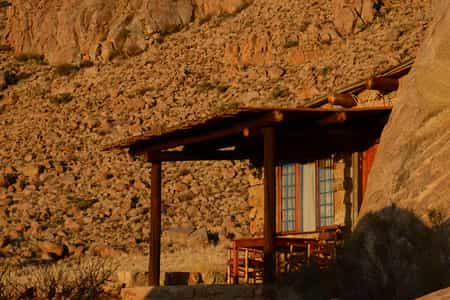 Each of the natural rock chalets sits between massive granite boulders and contains a bathroom, kitchenette, fireplace and private veranda.