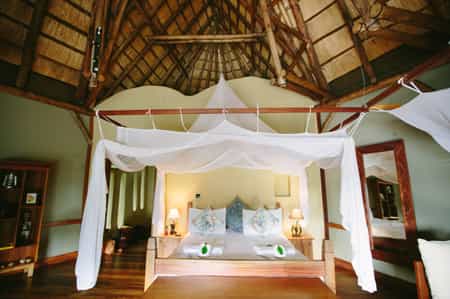 Large ensuite bedrooms with a combination of double and twin beds and an additional day bed.  A writing desk, small lounge and private deck to enjoy the views