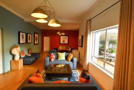 The bright and colourful lounge is the perfect place to relax after a long day of exploring Victoria Falls.