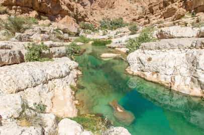 Explore the scenic valley of Wadi Shab, Sur